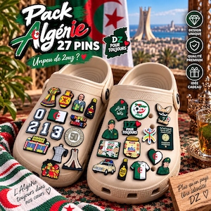 May include: A pair of beige clogs decorated with 27 colorful shoe charms featuring Algerian cultural symbols, including the national flag, a passport, a soccer ball, a car, and various text elements like "Pack Algérie" and "DZ POUR TOUJOURS."