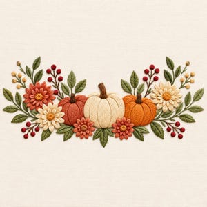 May include: An embroidery design featuring three pumpkins in cream, rust, and orange, surrounded by green leaves, red berries, and flowers in shades of cream, orange, and rust, all stitched onto a plain, light-colored fabric background.
