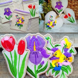 May include: A collection of embroidered floral designs. Includes drawstring bags with iris, tulip, and pansy designs, heart-shaped pillows with floral embroidery, and individual flower patches. The color palette features purple, red, yellow, and green.