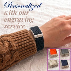 May include: A dark blue braided fabric bracelet with a silver-toned metal clasp engraved with the letters MB. The bracelet is worn on a wrist. Additional inset images show variations in orange, grey, white, and blue with custom engravings.