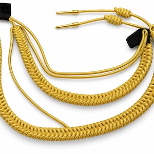 May include: A gold-colored braided cord accessory featuring two long, smooth gold cords with metallic aglets at the ends. The design includes two thick, textured braided sections connected by black fabric loops, creating a layered, looped appearance.