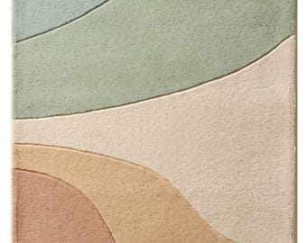 May include: A rectangular area rug featuring a textured, tufted surface with abstract, flowing curved lines. The design displays a color palette of soft blue, sage green, cream, tan, and terracotta, creating distinct sections across the rug.