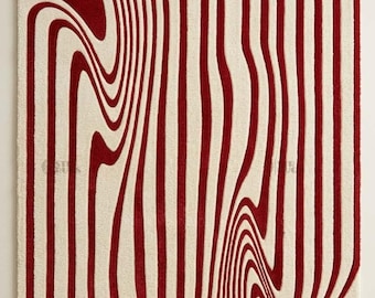 May include: A rectangular area rug featuring a high-contrast pattern of deep red and off-white vertical lines. The lines are not straight but instead curve and warp in a fluid, liquid-like motion across the entire surface of the textile.
