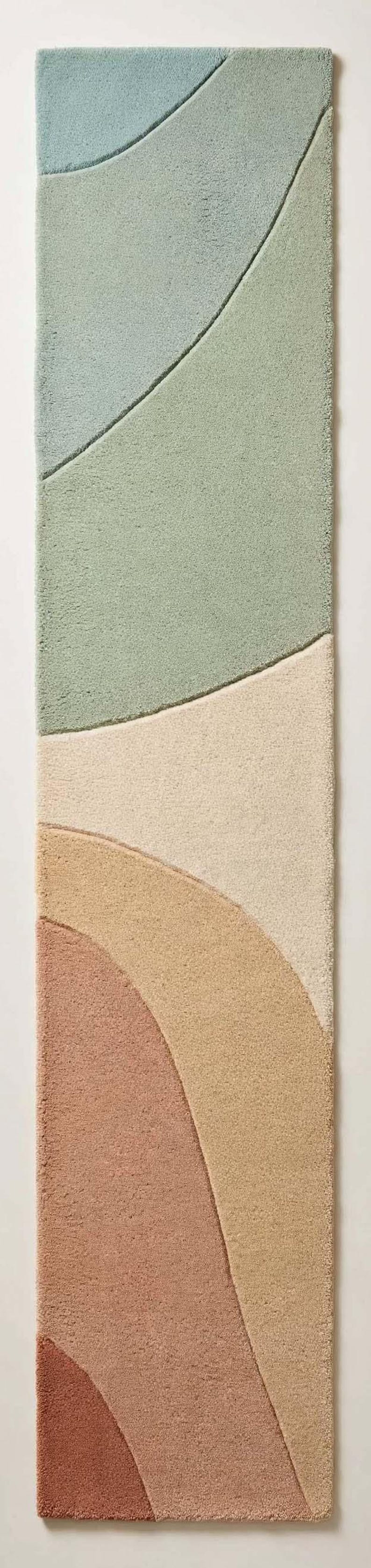 May include: A rectangular runner rug featuring a tufted texture with abstract, curved color-blocked sections in shades of light blue, sage green, cream, tan, terracotta, and deep rust, separated by carved grooves in the pile.