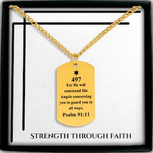 May include: A gold-toned dog tag pendant necklace featuring a black engraved star, the number 497, and the text: For He will command His Angels concerning you to guard you in all ways. Psalm 91:11. The card below reads STRENGTH THROUGH FAITH.