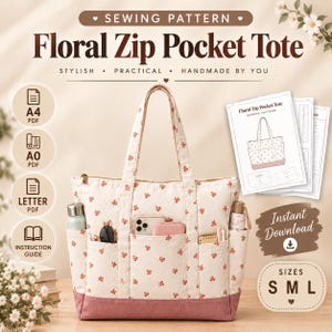 May include: A sewing pattern for a Floral Zip Pocket Tote. The tote is cream-colored with a small red floral print and a solid mauve base. It features two top handles, a zippered top, and three exterior front pockets containing various items.