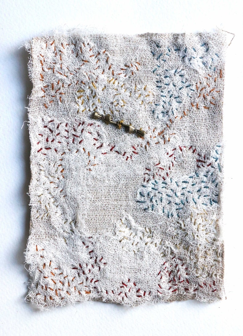 the tame time talisman hand in hand embroidery