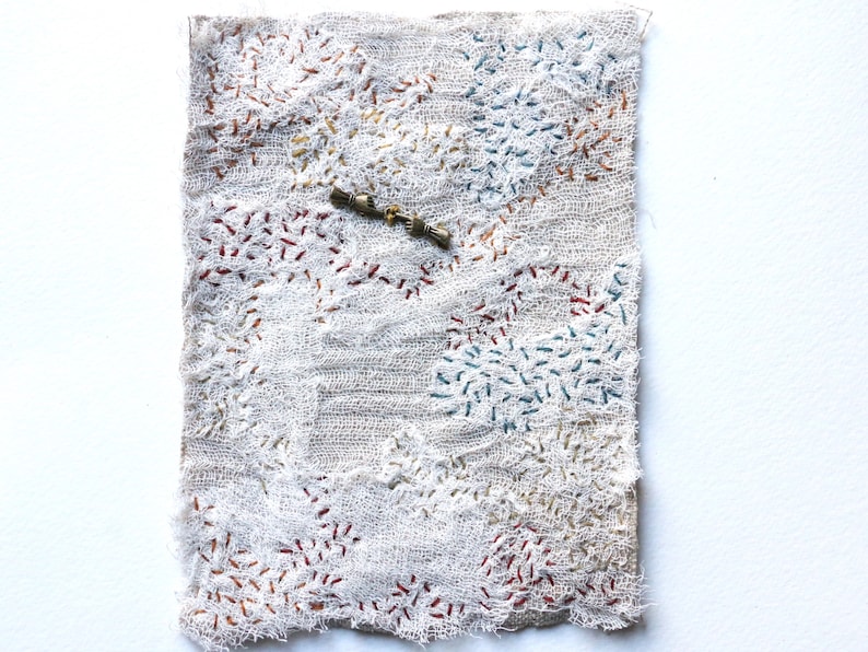 the tame time talisman hand in hand embroidery