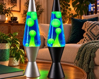 May include: Two lava lamps with conical bases and caps. The left lamp has a silver finish, while the right lamp has a black finish. Both glass vessels contain a deep blue liquid with bright neon green wax blobs floating in various shapes.
