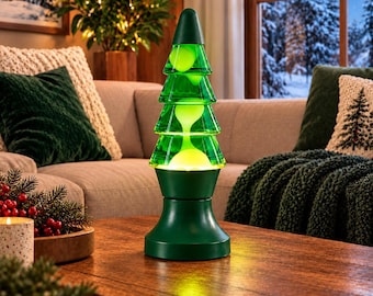May include: A Christmas tree-shaped lava lamp with a dark green base and top. The clear glass middle section contains green liquid and glowing yellow wax blobs that move within the tiered, conical structure of the lamp.