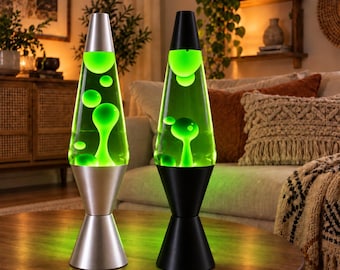 May include: Two lava lamps with conical bases and caps. One lamp features a silver metallic finish, while the other has a matte black finish. Both glass vessels contain a clear liquid with bright green wax blobs in various shapes and sizes.