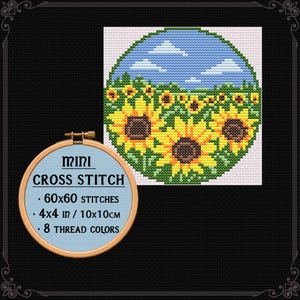 May include: A cross stitch pattern featuring a circular landscape of yellow sunflowers under a blue sky with white clouds. A wooden embroidery hoop displays the text: MINI CROSS STITCH, 60x60 STITCHES, 4x4 in / 10x10cm, 8 THREAD COLORS.