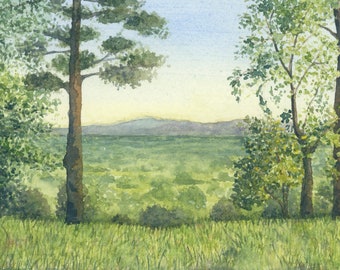 May include: A watercolor painting of a landscape scene with a view of a valley and distant mountains. The foreground features a grassy field with two trees on either side of the painting. The trees are green and have a light blue sky in the background.
