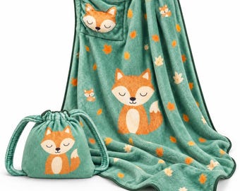 May include: A soft green plush blanket and a matching drawstring pouch, both featuring a repeating pattern of orange foxes and scattered autumn leaves. The blanket includes a plush fox head applique in the top corner.