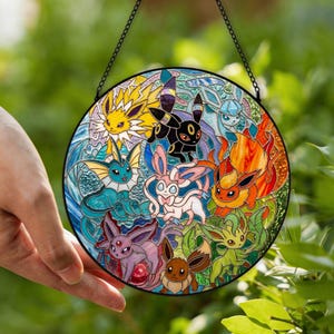 May include: A circular stained glass suncatcher featuring a colorful arrangement of nine distinct fictional creatures. The design includes yellow, blue, black, pink, orange, purple, brown, and green characters with intricate leaded lines.