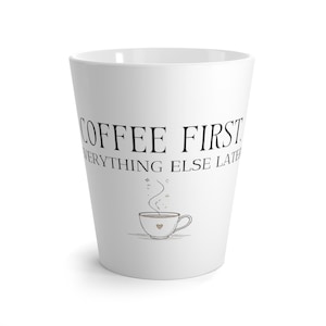 May include: A white conical mug featuring the black text COFFEE FIRST. EVERYTHING ELSE LATER. Below the text is a small line drawing of a steaming cup with a tiny heart on its side, accompanied by delicate swirling steam lines and small star accents.