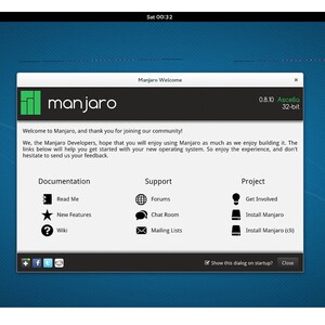 May include: A Manjaro Linux welcome screen with a green logo and the text "Manjaro Welcome" at the top. The screen displays information about the operating system, including the version number, codename, and bit depth. It also includes links to documentation, support, and project resources.