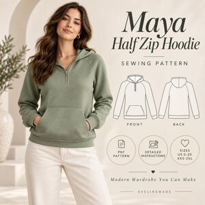 Peut inclure: Un sweat à capuche vert sauge avec fermeture éclair, poche kangourou et capuche. Le texte indique Maya Half Zip Hoodie, Sewing Pattern, PDF Pattern, Detailed Instructions, Sizes US 0-20 XXS-2XL, Modern Wardrobe You Can Make, Avelinemade.
