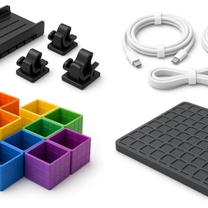 May include: A collection of desk organization accessories including a black tray, three black cable clips, two white USB-C charging cables, a set of nine colorful square storage bins in orange, yellow, green, blue, and purple, and a dark gray grid mat.