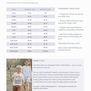 two young children, a boy and a girl, standing together and smiling.