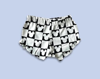 Girls Monochrome Checkered Mickey Ruffle Shorts Kids & Baby Disney shorts, Mickey Shorts, Girls Disney Shorts, Girls Disney Outfit