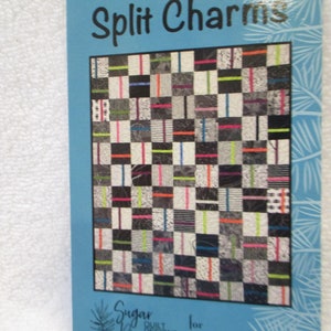 May include: A quilting pattern called "Split Charms" by Sugar Quilt. The pattern features a colorful quilt design with black, white, and bright colors like green, orange, pink, and blue.