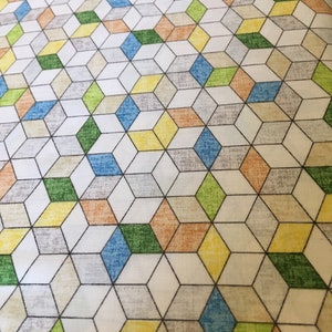 Clothworks Cotton Fabric Forest Glade in Green with geometric cubes in various colors