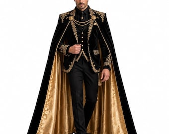 May include: A black velvet cape and matching suit jacket featuring intricate gold embroidery, a gold chain closure, and a metallic gold lining. The ensemble includes a black button-down vest, black trousers, and a black shirt, creating a formal look.