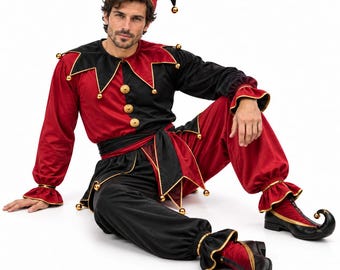 May include: A jester costume featuring a red and black color-blocked long-sleeve top with a jagged collar, a matching pointed hat, a waist sash, loose-fitting trousers, and curled-toe shoes, all accented with small gold bells throughout the garment.