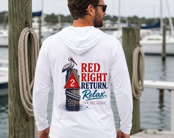 May include: A white long-sleeve hooded shirt featuring a graphic on the back of a pelican perched on a wooden piling with a red triangular sign marked with the number 2. The text reads RED RIGHT RETURN. Relax. LOW KEY LIVING.
