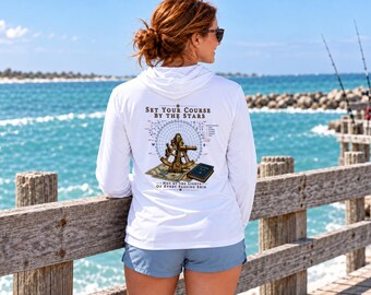 May include: A white long-sleeve hooded shirt featuring a back graphic of a brass sextant, a navigation chart, and a book. The text reads: SET YOUR COURSE BY THE STARS, NOT BY THE LIGHTS OF EVERY PASSING SHIP. The design includes a compass rose.