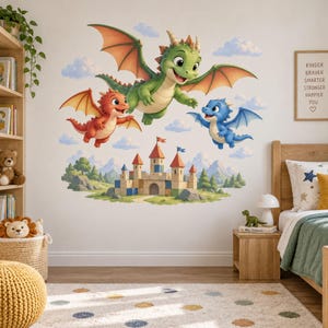 May include: A wall decal set featuring three cartoon dragons in green, red, and blue flying above a stone castle. The scene includes white clouds, green trees, and mountains. A framed sign on the wall displays the text: KINDER BRAVER SMARTER STRONGER HAPPIER YOU.