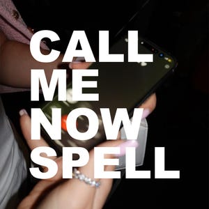 May include: A black smartphone displaying an incoming call screen with a red decline button and a green accept button. The screen features the bold white text CALL ME NOW SPELL overlaid across the display. The device is held in a hand with light pink nails.
