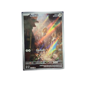May include: A holographic Meltan trading card featuring the character with 80 HP. The card displays the Headbutt attack with 50 damage, a metal type symbol, and the text 179/162. The artwork shows a metallic creature in a workshop setting.