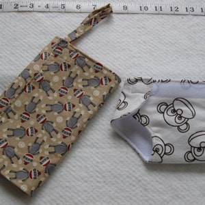 mini flip and go diaper changing pad for dolls/baby doll changing pad with doll diaper/clutch with pockets -  sock monkeys