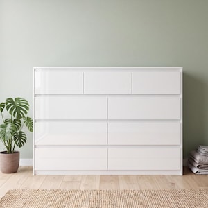 May include: A white dresser featuring a glossy finish with a total of nine drawers arranged in four horizontal rows. The top row contains three smaller drawers, while the three rows below each consist of two wide, rectangular drawers.
