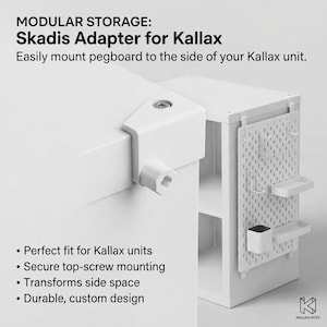 May include: A white plastic Skadis adapter for Kallax storage units, featuring a top-screw mounting mechanism. The text reads: MODULAR STORAGE: Skadis Adapter for Kallax. Easily mount pegboard to the side of your Kallax unit. Perfect fit for Kallax units.