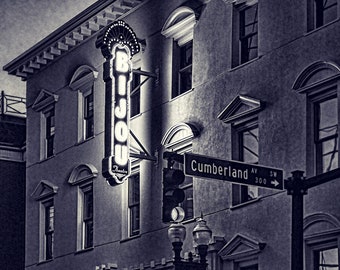 May include: A black and white photo of the Bijou Theatre in Knoxville, Tennessee. The marquee reads "ENTERTAINING KNOXVILLE FOR 108 YEARS" and "JAM GREGORY 3/9".