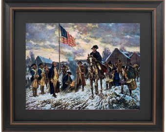 May include: A painting depicting a historical scene of George Washington and his troops in a snowy encampment. The American flag is flying in the background, and the soldiers are gathered around a fire. The painting is framed in a dark wood frame.