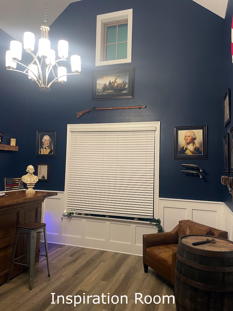 a living room with blue walls and a white window