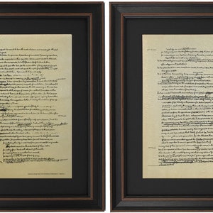 May include: Two framed documents with black ink on a cream-colored background. The text is in a cursive font and includes the words "Declaration of Independence of the United States of America".