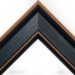 a triangle shaped picture frame with a wooden edge