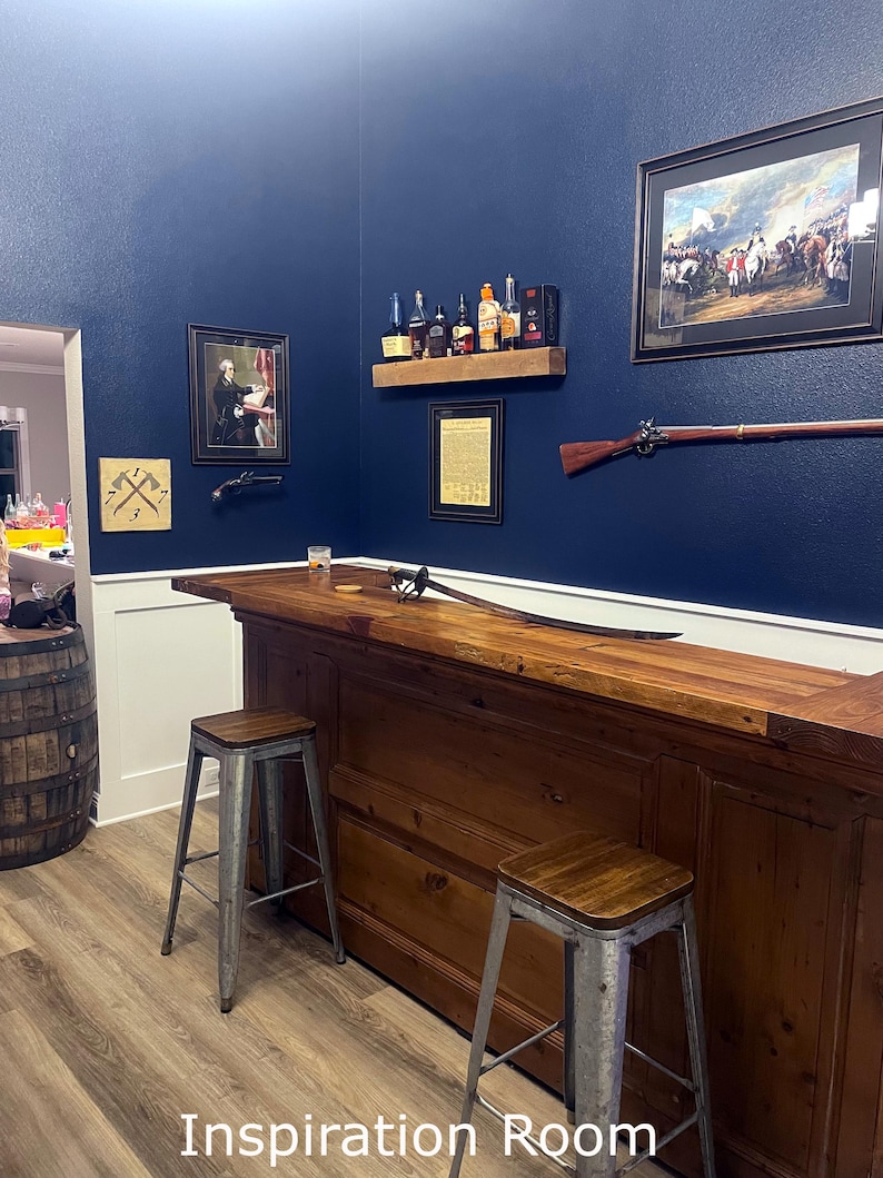 a bar with two stools in a room