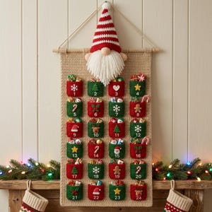 May include: A beige crocheted wall hanging advent calendar featuring a gnome with a red and white striped hat at the top. It has twenty-four small red and green pockets, each numbered one through twenty-four, decorated with various holiday icons.