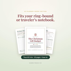 May include: A set of A5 planner inserts titled The Christmas Gift Budget, featuring a central cover page with a gift icon and two side pages showing budget tracking columns. The text reads Fits your ring-bound or traveler's notebook and True A5 trim.