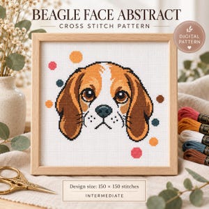 May include: A cross stitch pattern titled BEAGLE FACE ABSTRACT featuring a brown, white, and black beagle dog face with colourful polka dots on white fabric, framed in light wood. The design size is 150 by 150 stitches, labelled as intermediate.