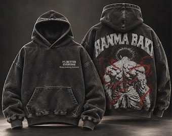 May include: A charcoal grey acid-wash hoodie featuring a front kangaroo pocket and the text 1% BETTER EVERYDAY Keep pushing forward. The back displays a graphic of a muscular figure with the text HANMA BAKI and red swirling accents.