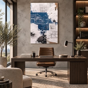 May include: A rectangular wall art piece featuring a layered composition of architectural blueprints in deep blue and white, accented with thick, textured impasto paint strokes and abstract black ink splatters across the canvas surface.