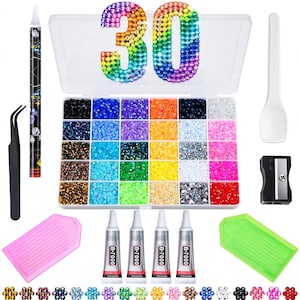 May include: A craft kit featuring a clear plastic organiser box filled with multi-coloured rhinestones, a number 30 design, four B-7000 glue tubes, two plastic trays, a black pair of tweezers, a wax pencil, a white spatula, and a pencil sharpener.