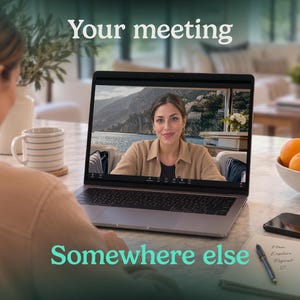May include: A laptop displaying a video call with a person on screen, positioned on a table with a bowl of fruit, a notebook, a pen, a smartphone, and a mug. The text "Your meeting" appears at the top and "Somewhere else" at the bottom.